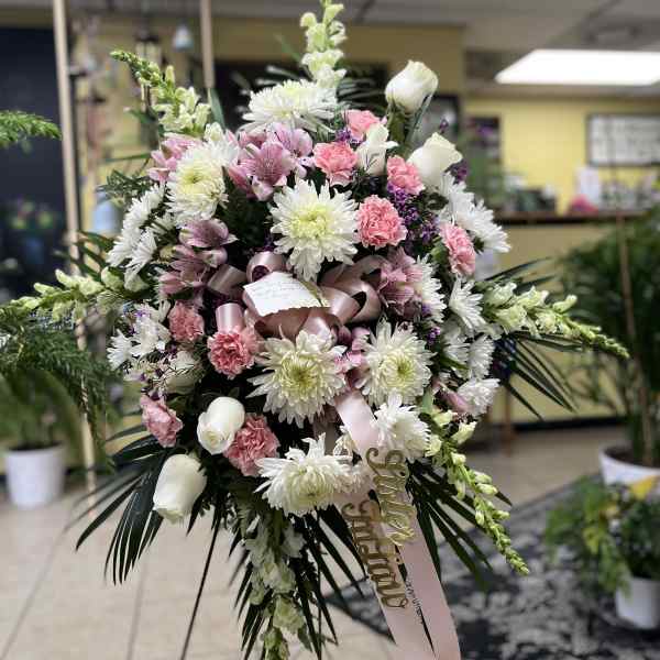Large pink and white floral spray with ribbon and card