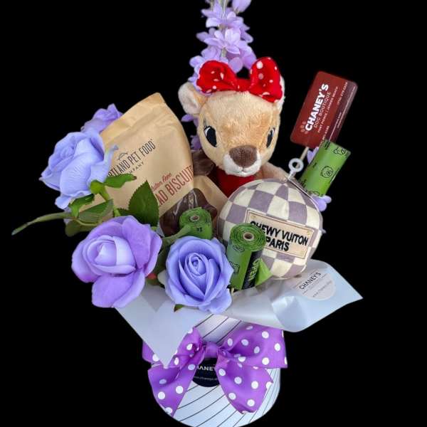 Purple rose bouquet with a plush deer, pet treats, and gift boxes