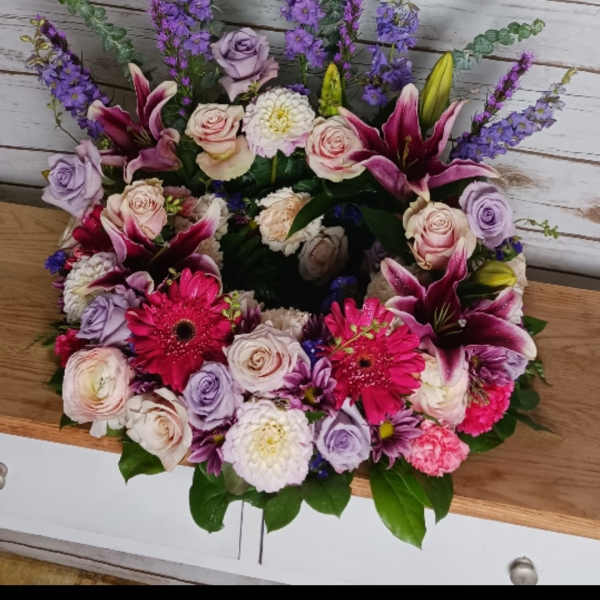 Mixed bouquet with pink lilies, roses, and purple flowers