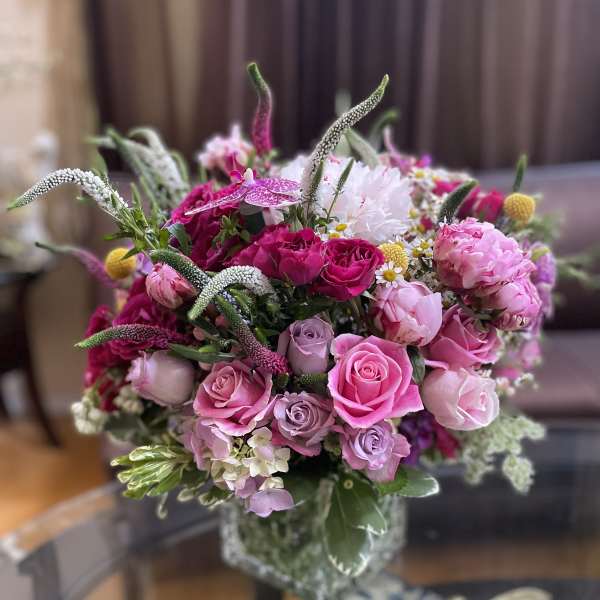 Pink and lavender bouquet in a glass vase