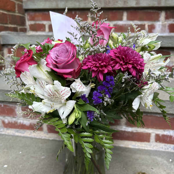 Pink and white mixed bouquet in a glass vase