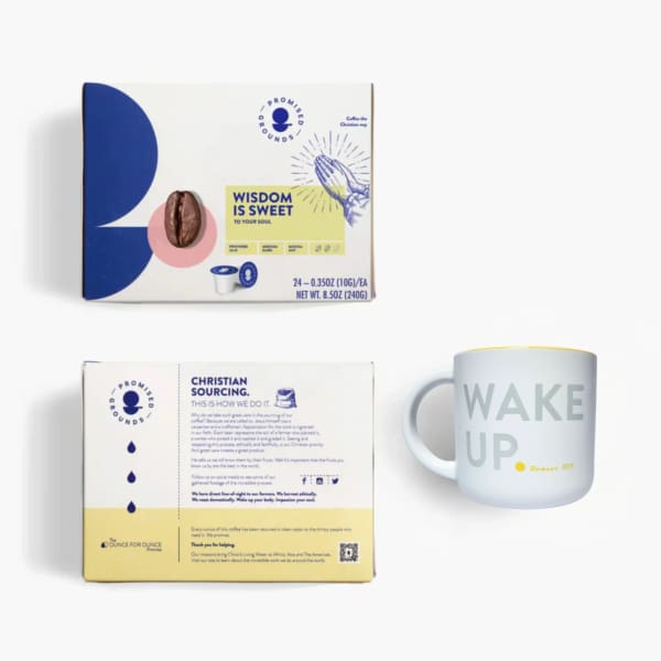 Coffee pod box and white mug with "WAKE UP" text
