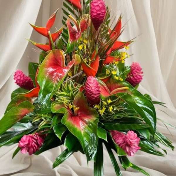 Tropical bouquet with red heliconia and pink ginger flowers