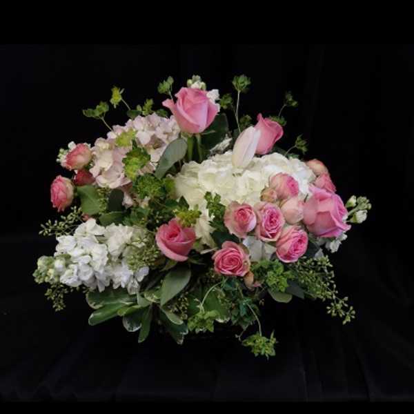 Pink roses and white hydrangeas in a lush bouquet