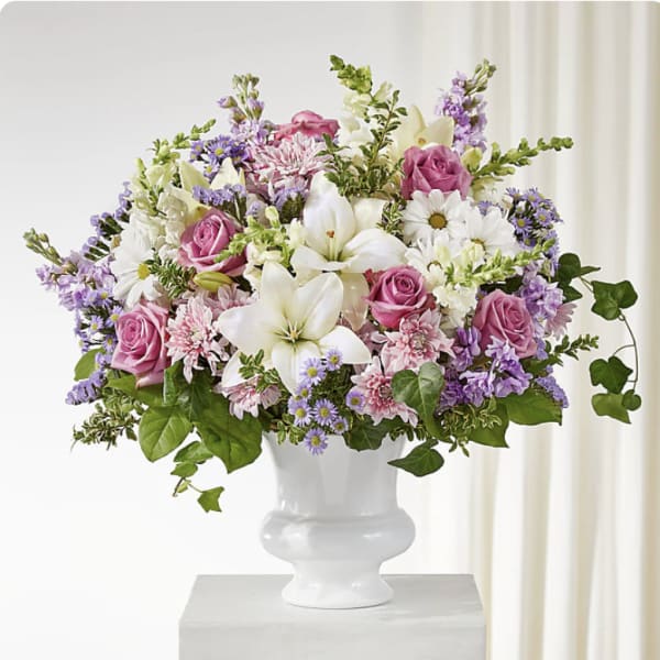 Pink and white mixed bouquet in a white vase