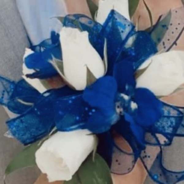 White roses with a blue ribbon bow