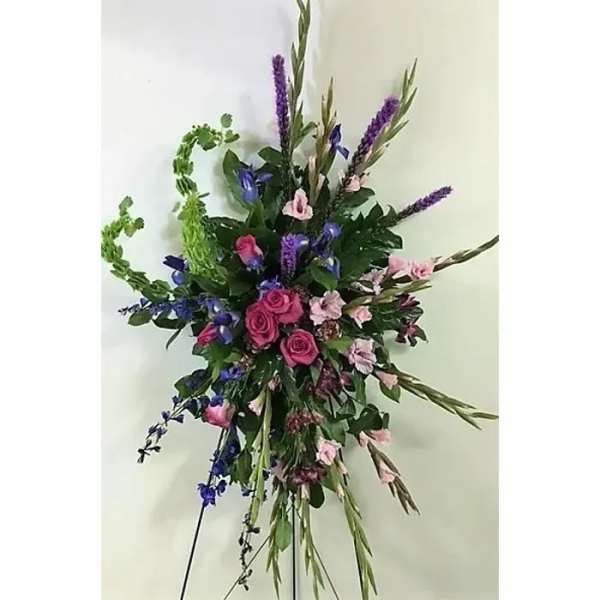 Tall floral spray with pink roses and purple blooms