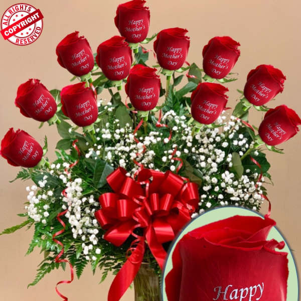 Bouquet of red roses with a red ribbon in a glass vase