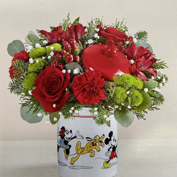 Red flowers arranged in a Mickey Mouse tin container