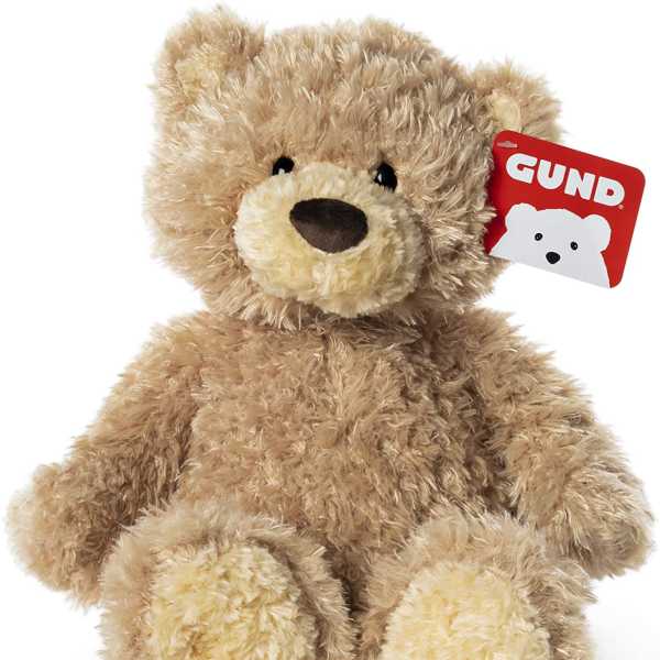 Plush teddy bear with a red GUND tag