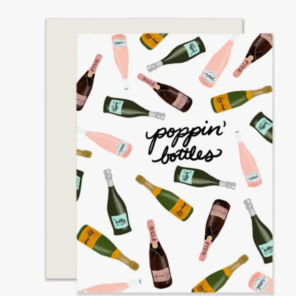 Greeting card with illustrated champagne bottles and the words poppin' bottles