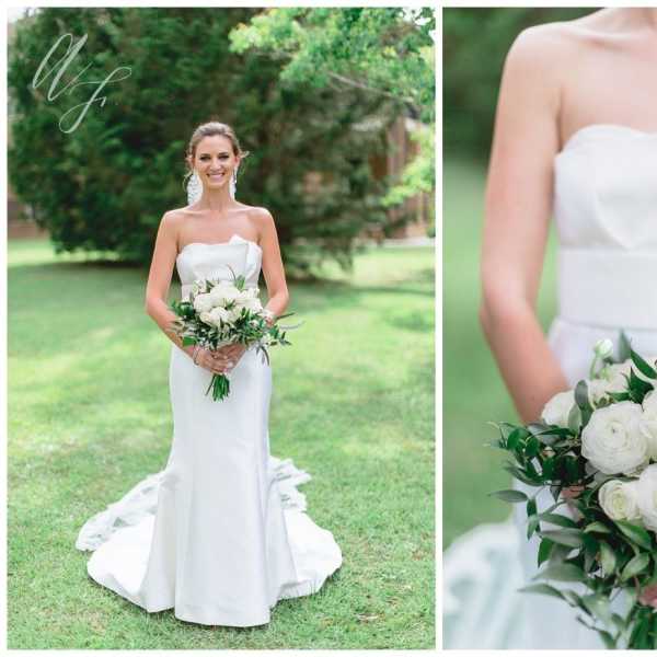 Bride holding a white rose bouquet with greenery