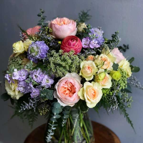Mixed pastel bouquet in a glass vase