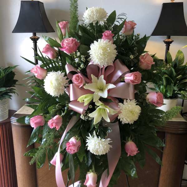 Pink and white funeral spray