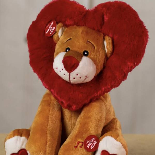Plush teddy bear holding a red heart