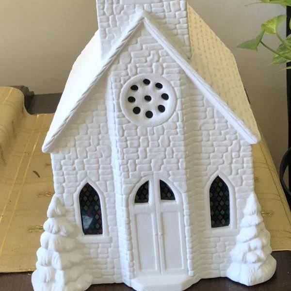 White decorative church figurine with a tall steeple