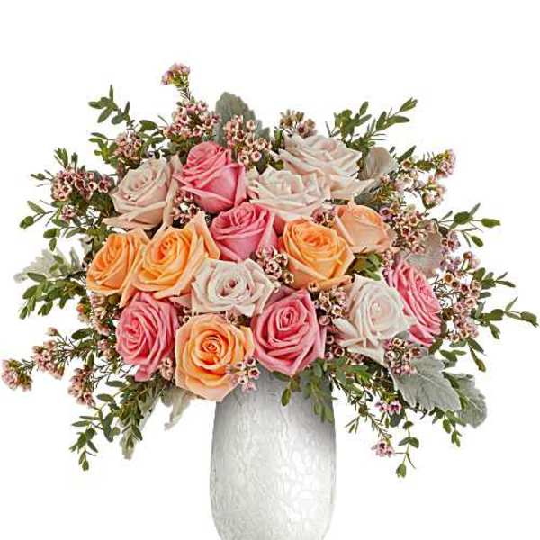 Bouquet of pink, peach, and white roses in a white vase
