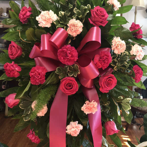 Pink and red funeral spray