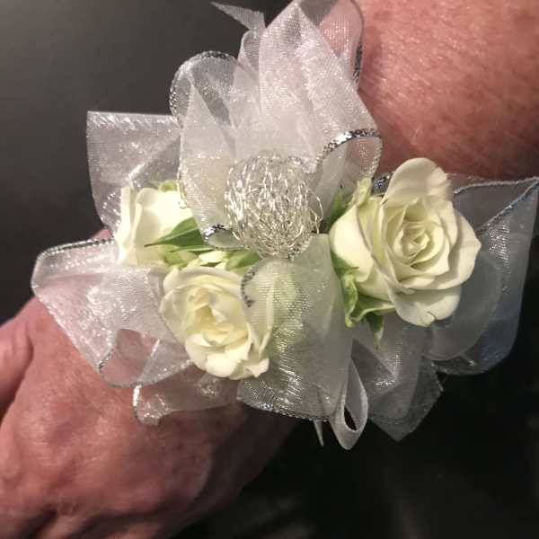 White rose corsage with silver ribbon and mesh bow