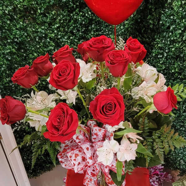 Red roses with white flowers and a heart balloon