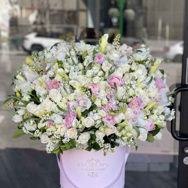 Large pastel bouquet in a pink hatbox with white and pink flowers