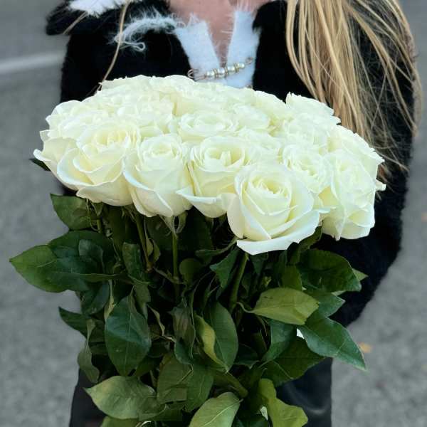 Bouquet of white roses with green foliage