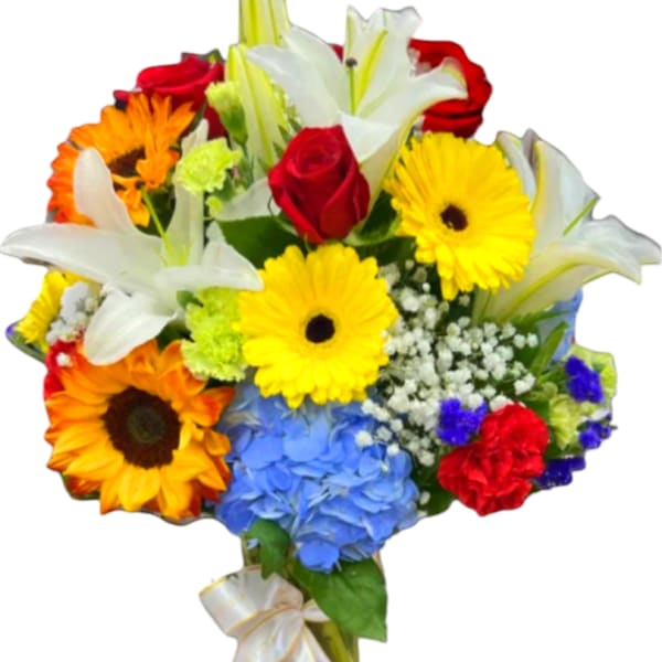 Mixed bouquet with lilies, roses, gerbera daisies, and hydrangea in a glass vase
