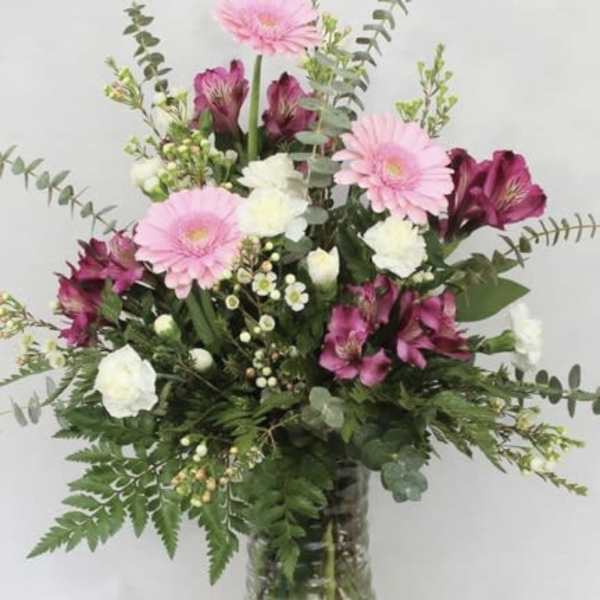 Pink and white mixed bouquet in a glass vase