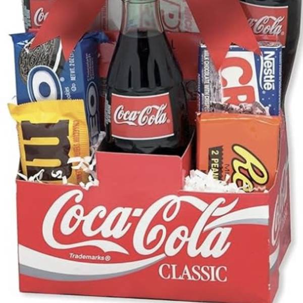 Gift box with Coca-Cola bottles, candy bars, and a large red bow