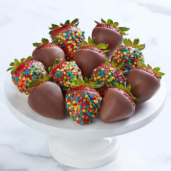 Chocolate-covered strawberries on a white pedestal stand
