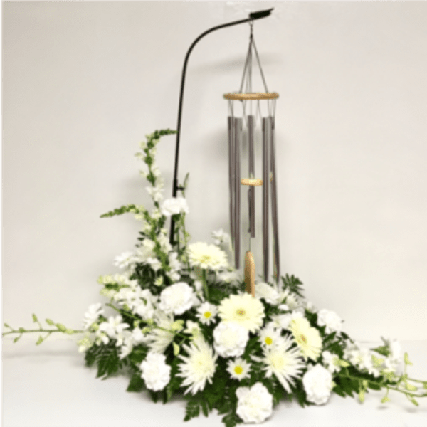 White floral arrangement with hanging wind chimes