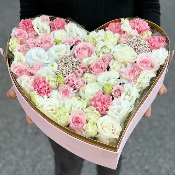 Heart-shaped box of pink and white roses and carnations