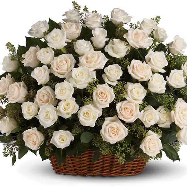 Basket of white and blush roses with greenery