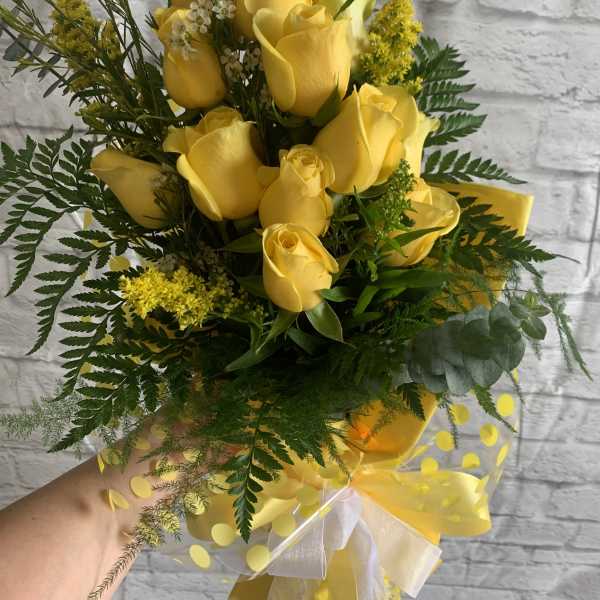 Yellow rose bouquet with greenery and a sheer ribbon wrap