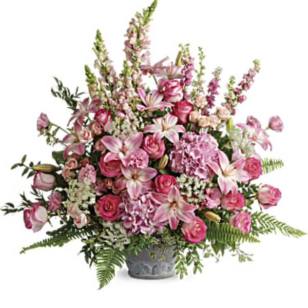 Pink mixed flower arrangement in a gray vase