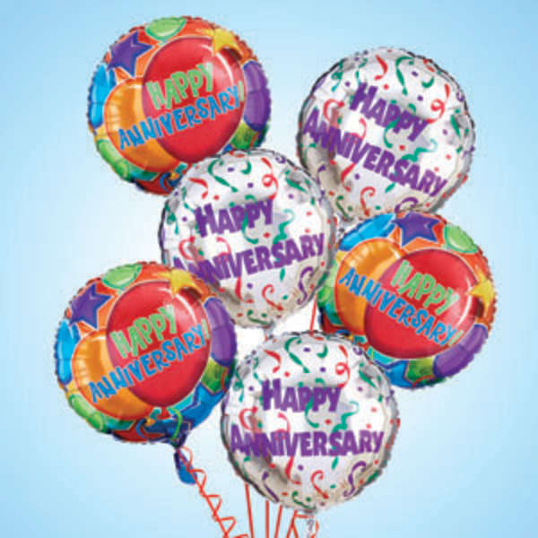 Cluster of happy anniversary balloons in bright colors
