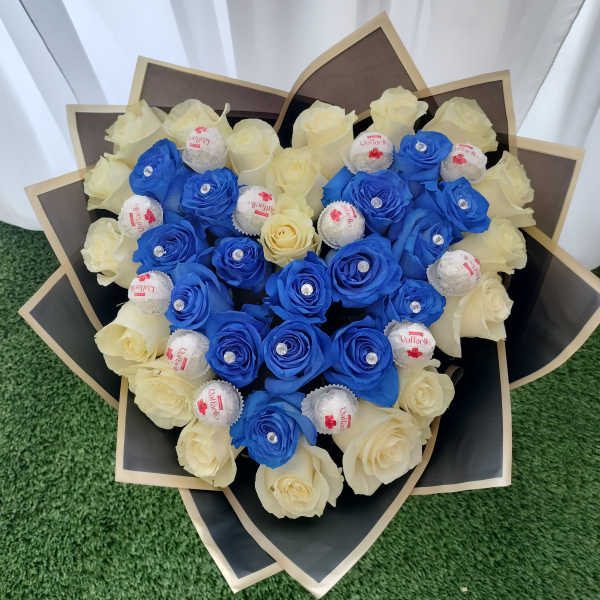 Bouquet of blue and cream roses with Raffaello chocolates
