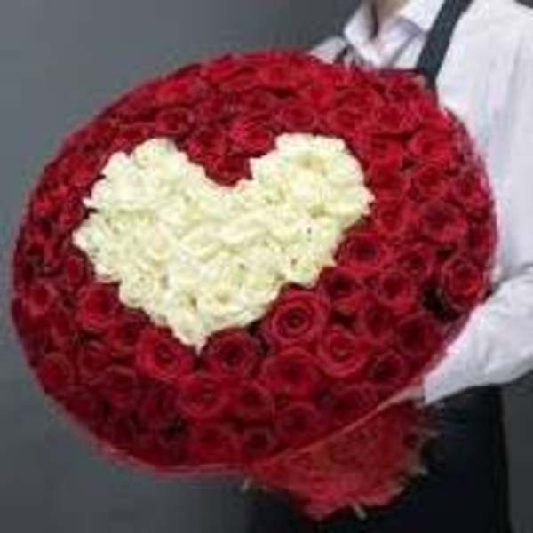 Heart-shaped bouquet of red and white roses