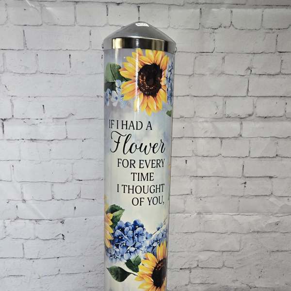 Tall sunflower-themed memorial cylinder with printed quote