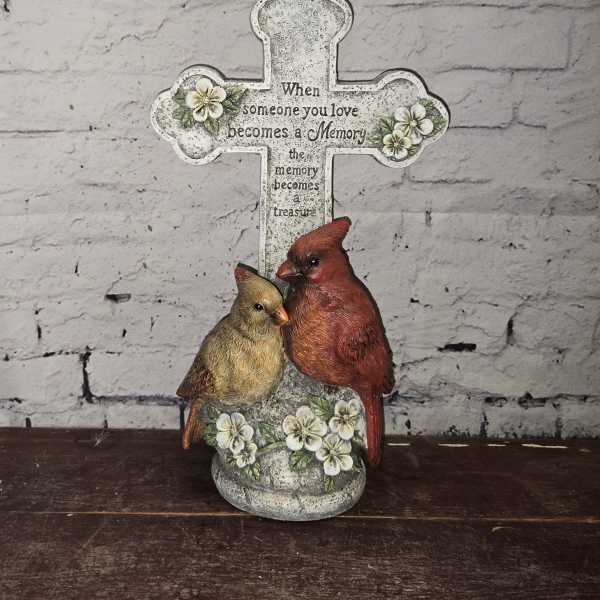 Decorative memorial cross with two birds and floral accents