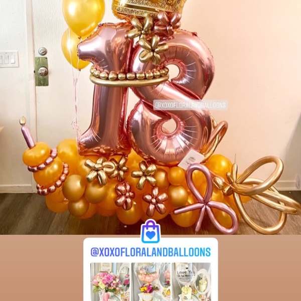 Gold crown balloon display with rose-gold number 18 balloons and yellow balloons