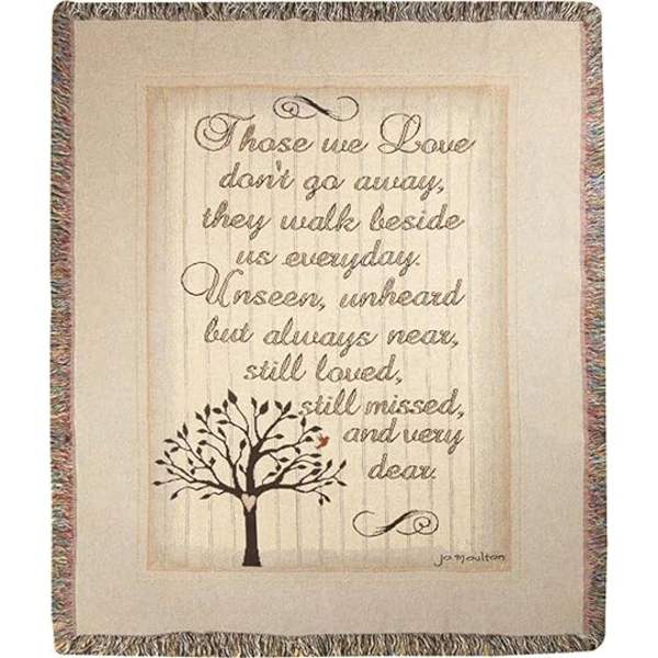 Framed memorial quote with a tree illustration on a woven throw blanket
