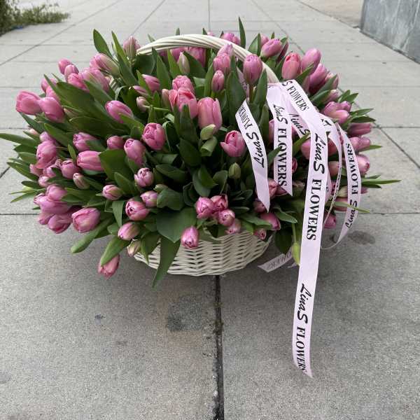 Basket of pink tulips with ribbon tags