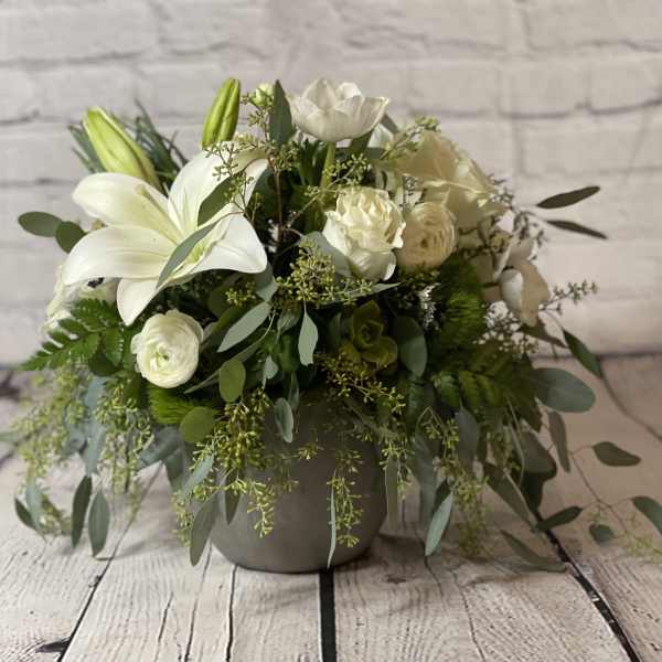 White lily and rose arrangement in a gray vase