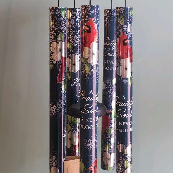 Hanging wind chime with floral and cardinal-print tubes