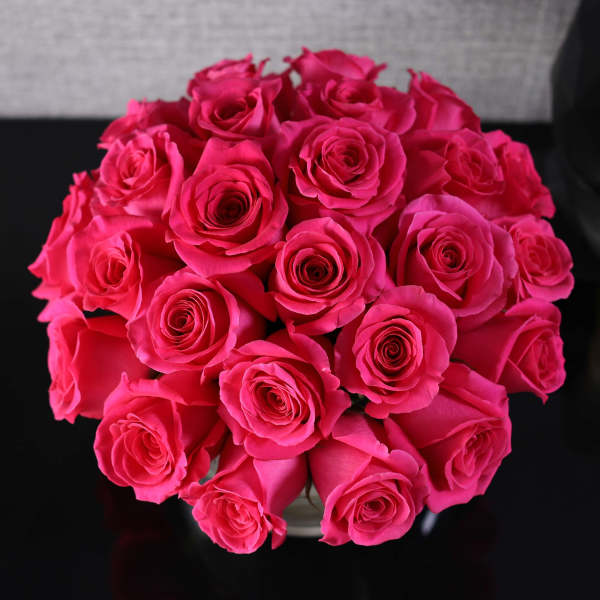 Bouquet of bright pink roses in a vase