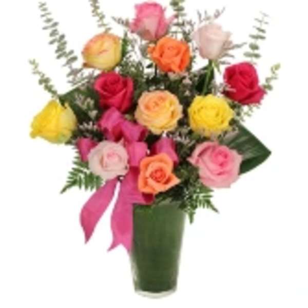 Colorful rose bouquet in a green vase with a pink ribbon