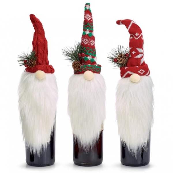 Three Christmas gnome bottle toppers with red hats and white beards