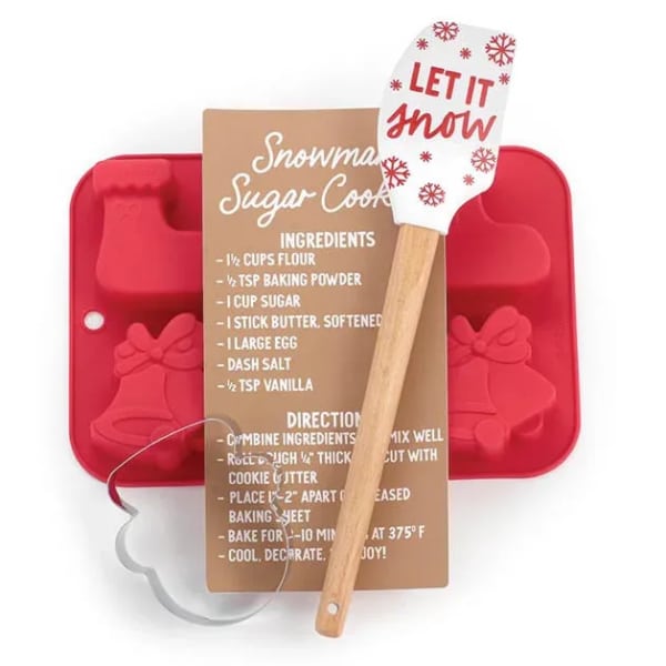 Red cookie mold with a recipe card and a spatula reading "Let it snow"