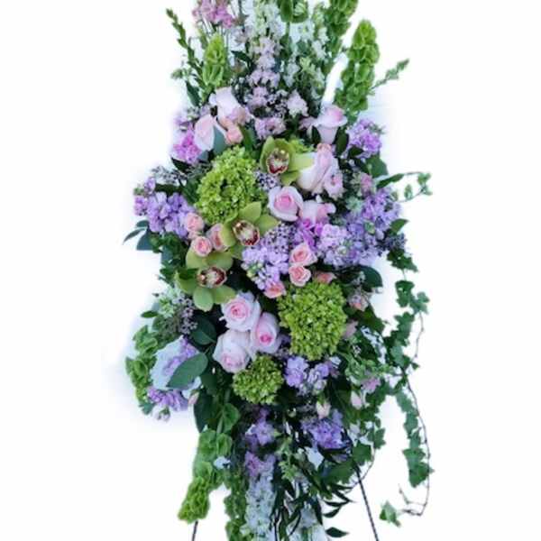 Tall floral standing spray with pink, purple, and green blooms
